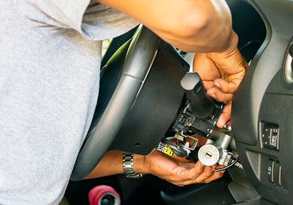 image of an automotive ignition lock being worked on by a locksmith